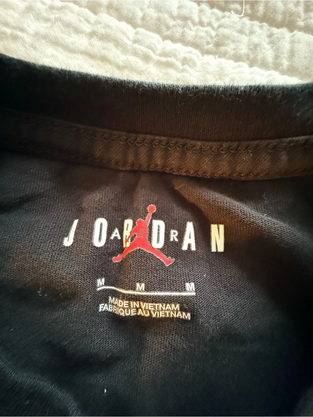 Jordan Black Long Sleeve Tee with White Logo and Orange Basketball Accent